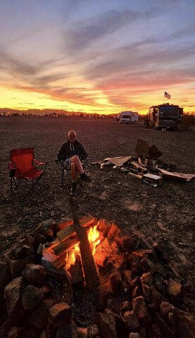 Tending the fire and sundown.